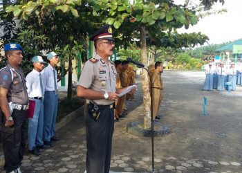 Kapolsek Perhentian Raja Pimpin Kegiatan Police Goes to School di SMA Negeri I Pantai Raja
