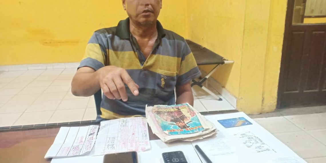 Opsnal Polsek Tapung Hulu Tangkap Penjual Nomor Togel Kim di Pasar Kasikan