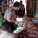 Kapolsek Kampar Kiri Kunjungi dan Bantu Warga Penderita Hepatitis B di Desa Sei Geringging