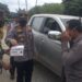 Kapolsek Tapung Hulu Bersama Aparatur Desa dan Babinsa Bagikan Masker di Desa Kasikan