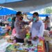 Kapolsek Tapung Pimpin Pendisiplinan Protkes dan Bagikan Masker di Pasar Muara Mahat Baru