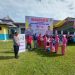 Mewakili Ketua Bhayangkari Polres Kampar, Ny. Donna M.Simanungkalit Serahkan Paket Sembako di HGN dan HUT PGRI Ke 77 di Kecamatan Tapung Hilir