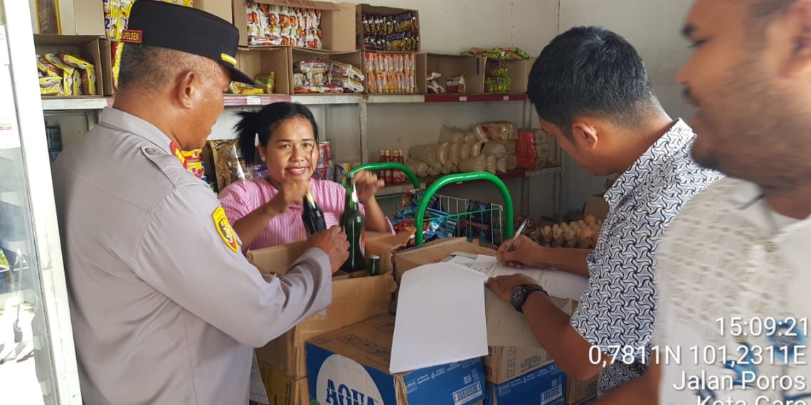 Polsek Tapung Hilir Gencarkan Patroli KRYD Jelang Natal dan Tahun Baru, Sita Miras di Warung Kota Garo